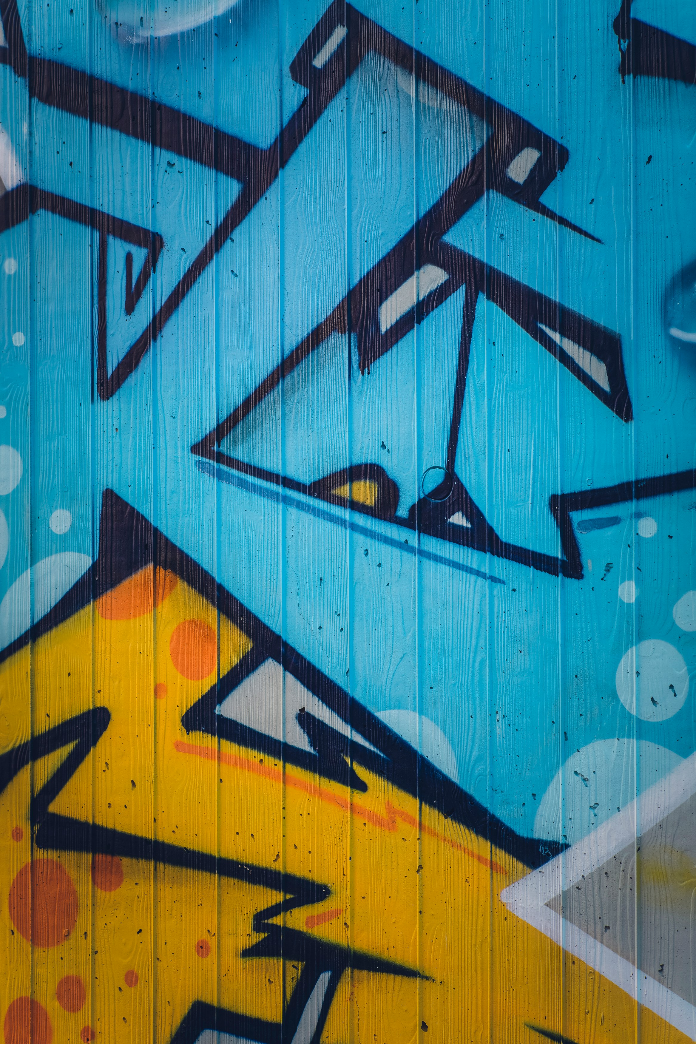 blue red and yellow wall graffiti